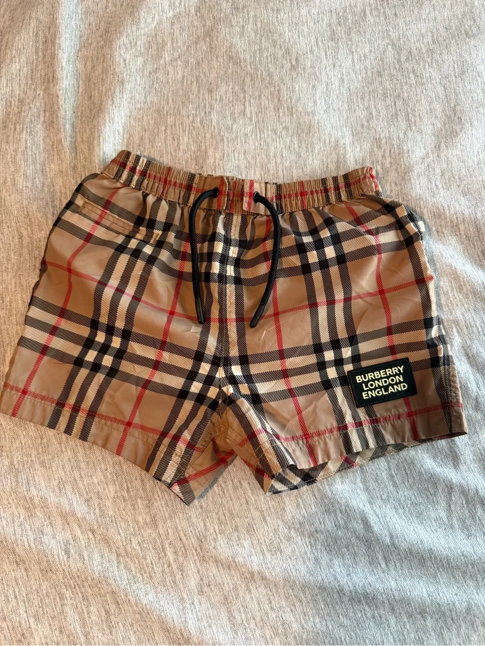 Authentic Burberry Tan Plaid Check Swim Shorts w/ Black & Red Accents 12 months